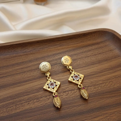 Gold Color Antique Earrings Showcasing Detailed Artistry And Traditional Elegance