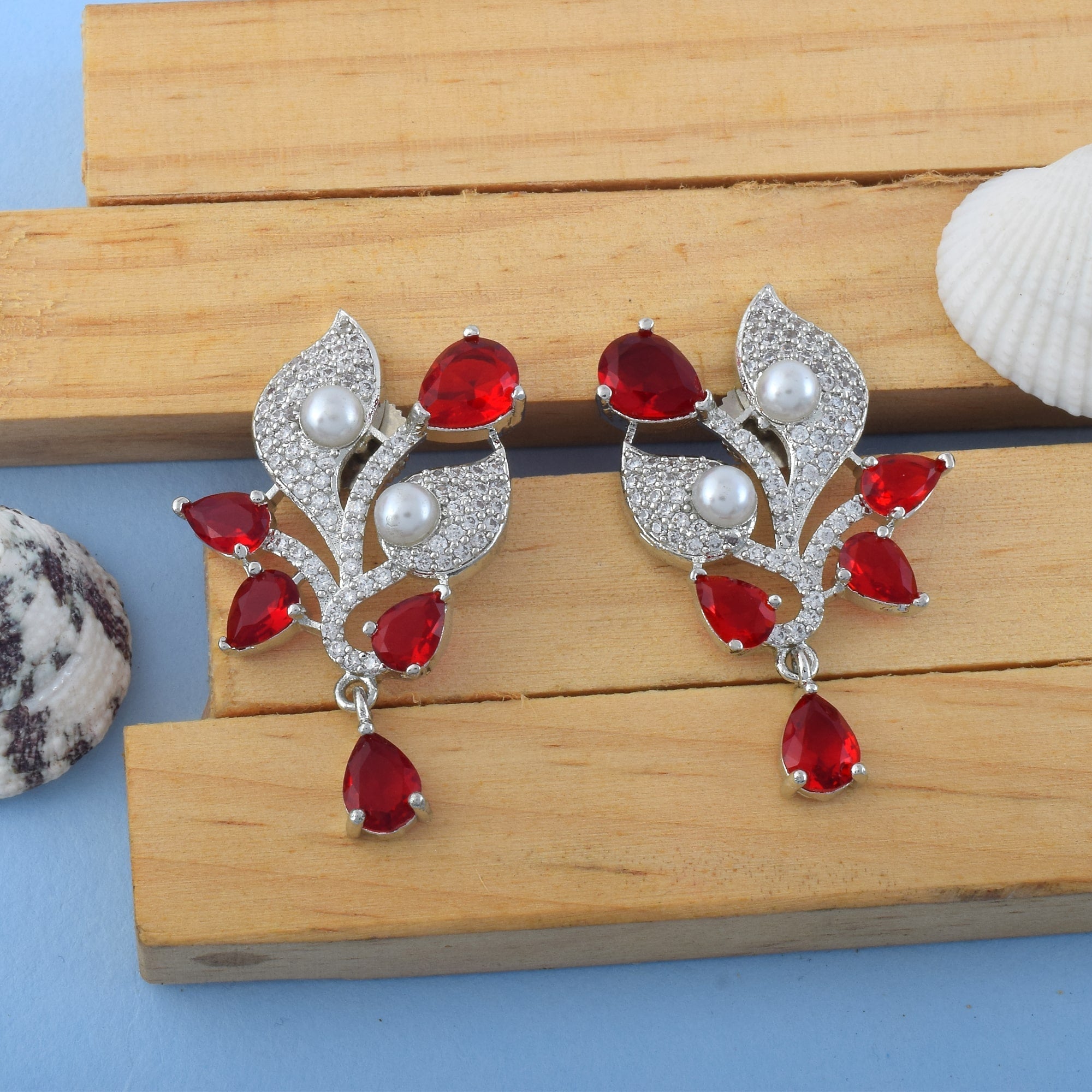Red Color American Diamond Earrings With Circular Sparkle Charm Look