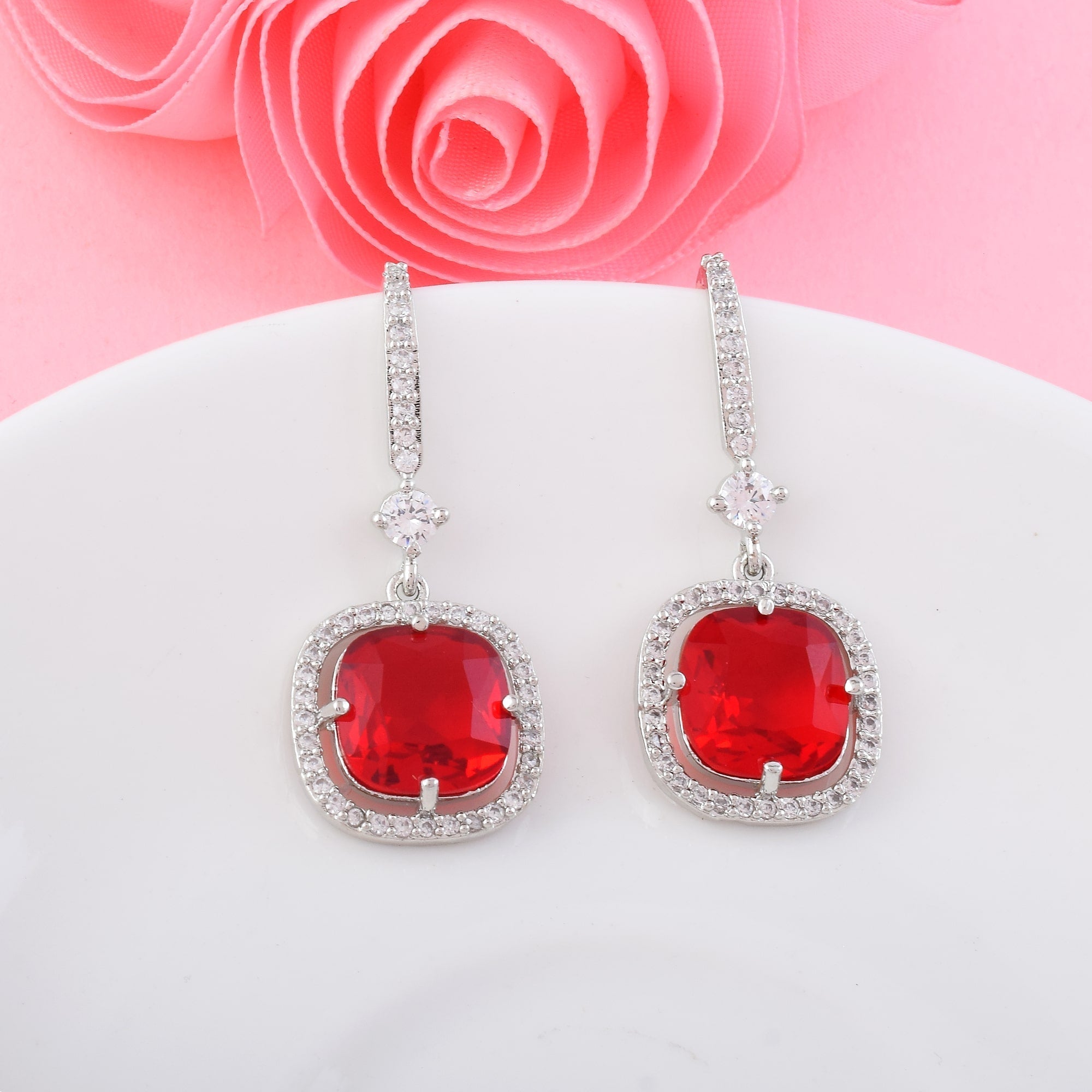 Red Color American Diamond Earrings In Twisted Loop Inspired Statement Design