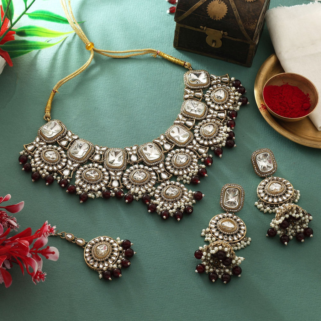 Elegant Maroon Color Kundan Necklace Set With Gold Polish For Royal Outfits