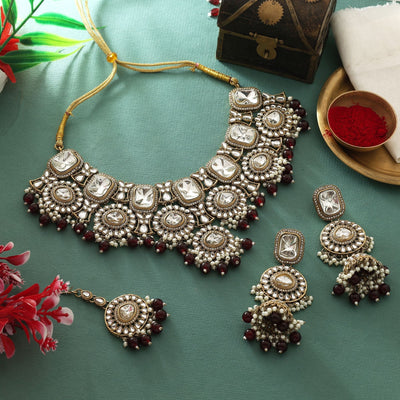 Elegant Maroon Color Kundan Necklace Set With Gold Polish For Royal Outfits