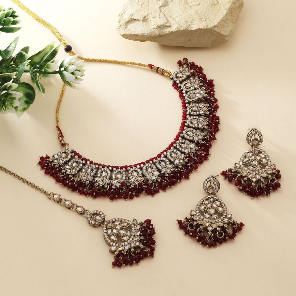 Traditional Maroon Color Kundan Necklace Set With Gold Polish For Bridal Fashion