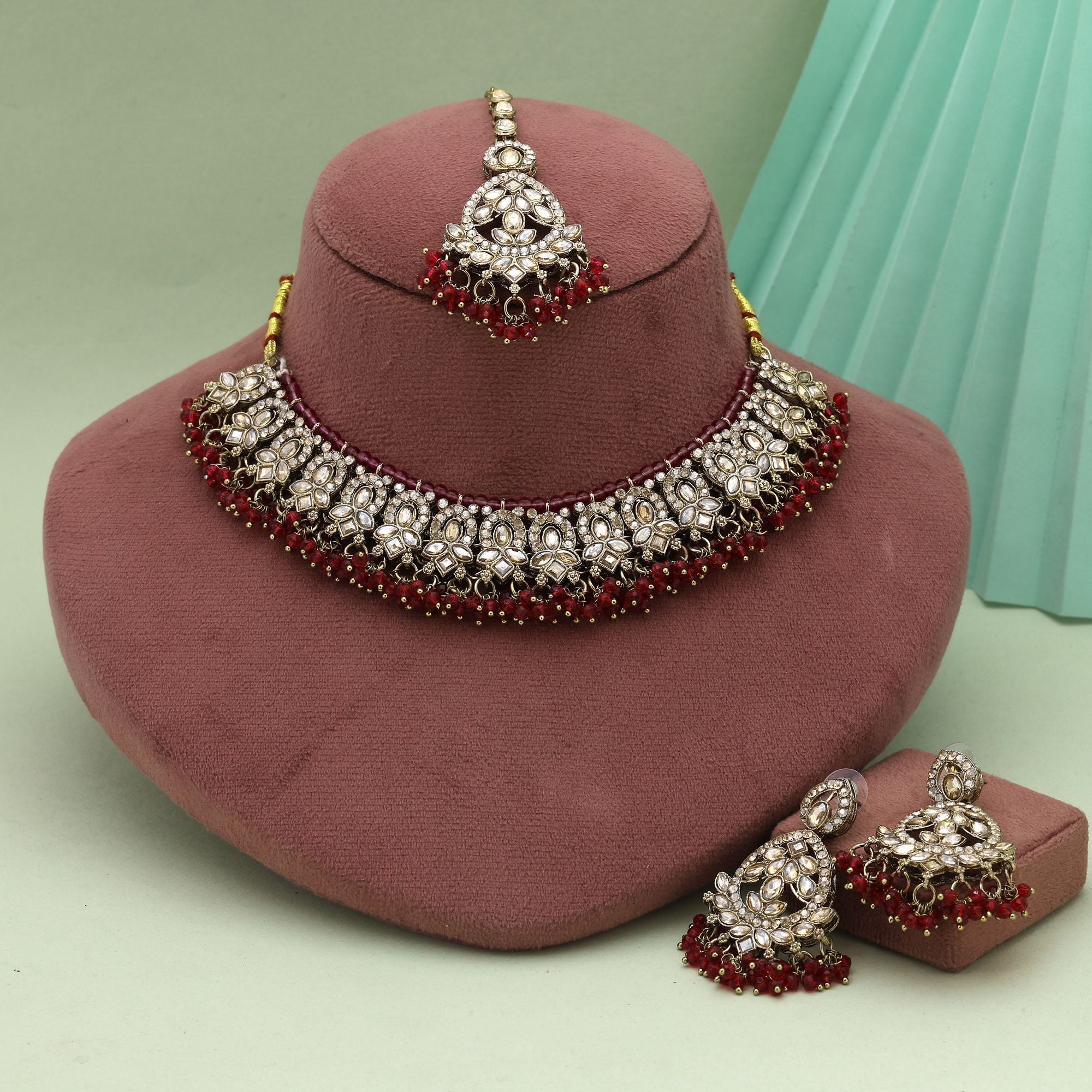 Traditional Maroon Color Kundan Necklace Set With Gold Polish For Bridal Fashion