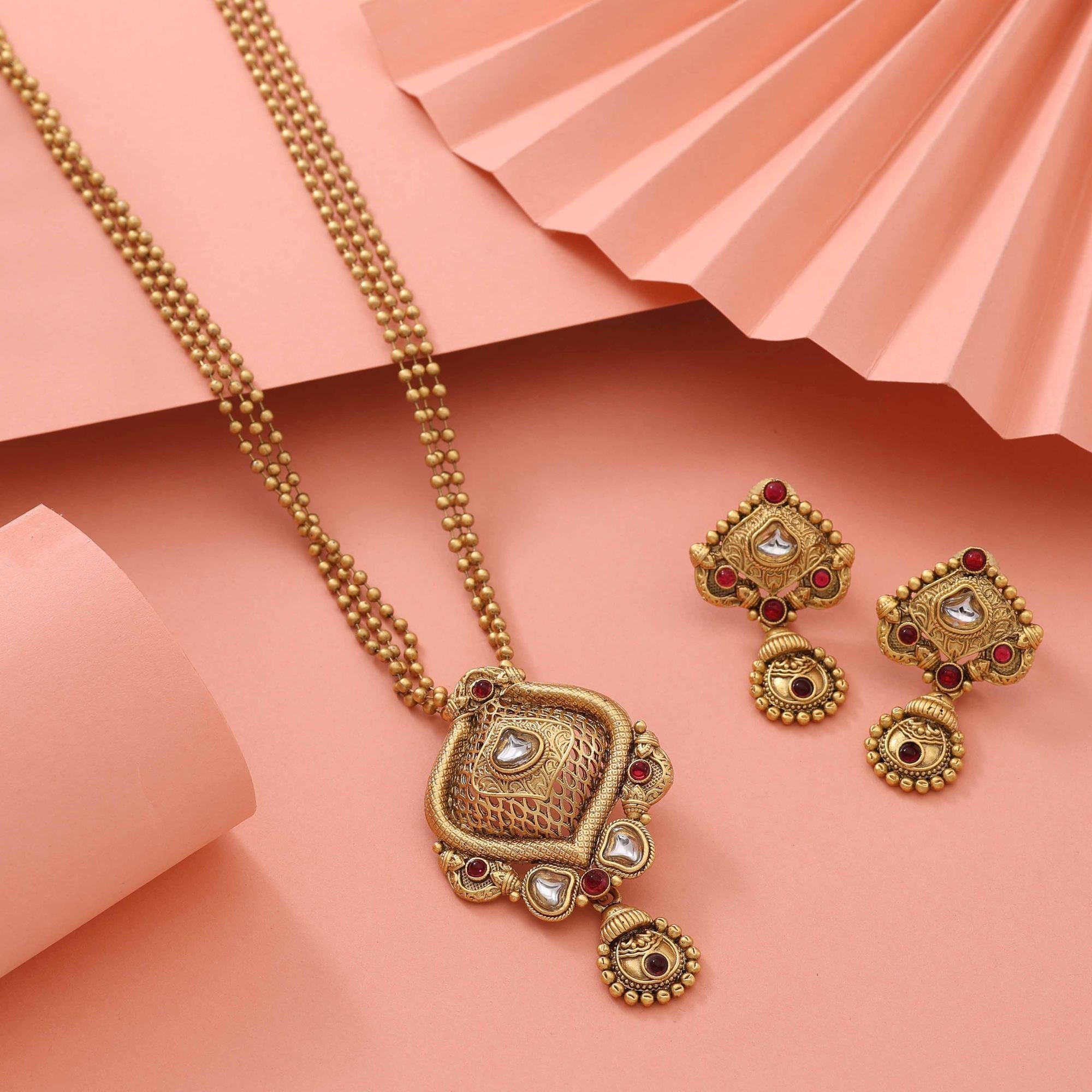 Stylish Rani Color Matte Gold Necklace Set With Stone Embellished Design