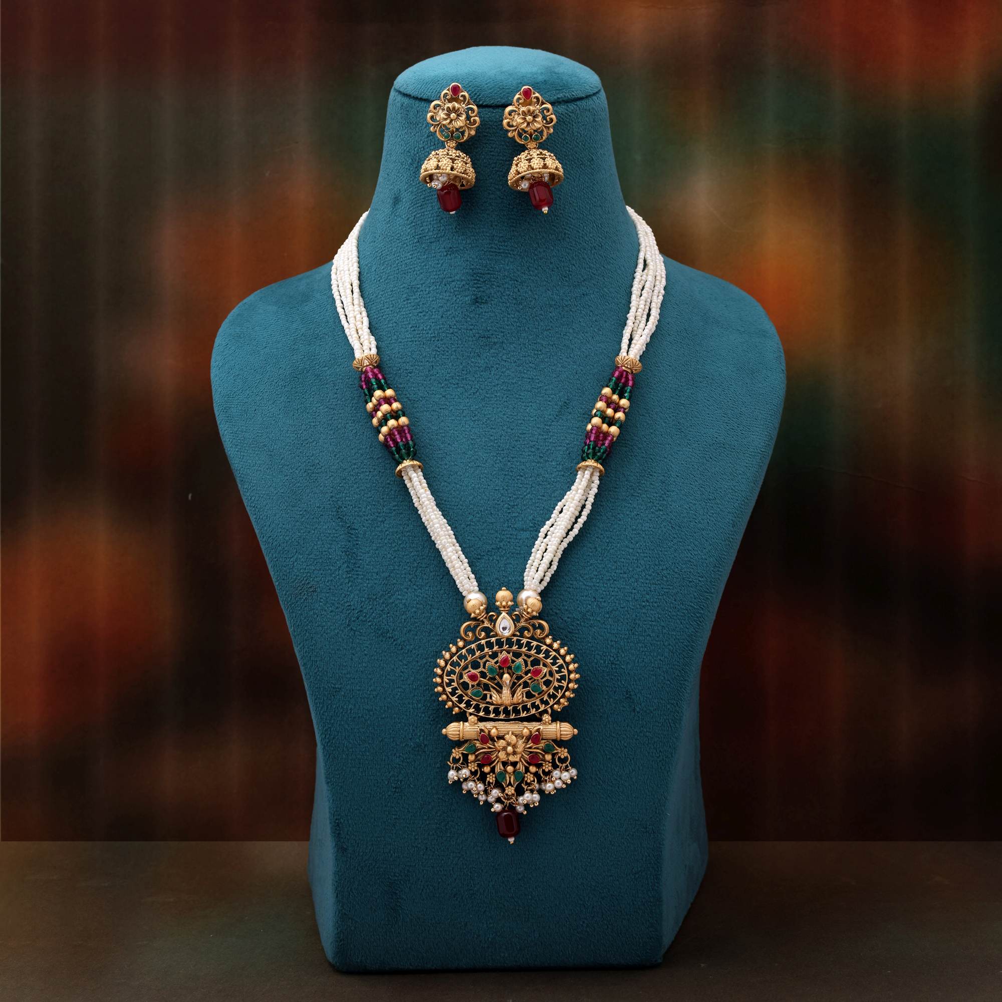 Charming Rani And Green Color Matte Gold Necklace Set Adorned With Kundan Work